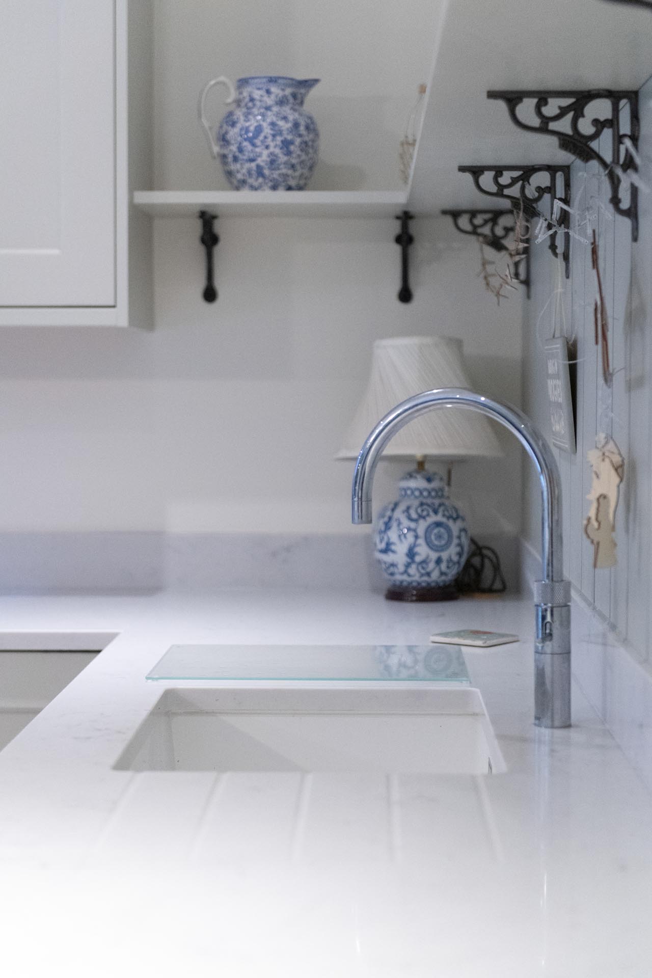 With the house lights off the kitchen os cool and calm. It becomes homely and warm at the flick of a switch. AG Carrara quartz worktops, quooker pro 3 tap. Oxshott surrey kitchen
