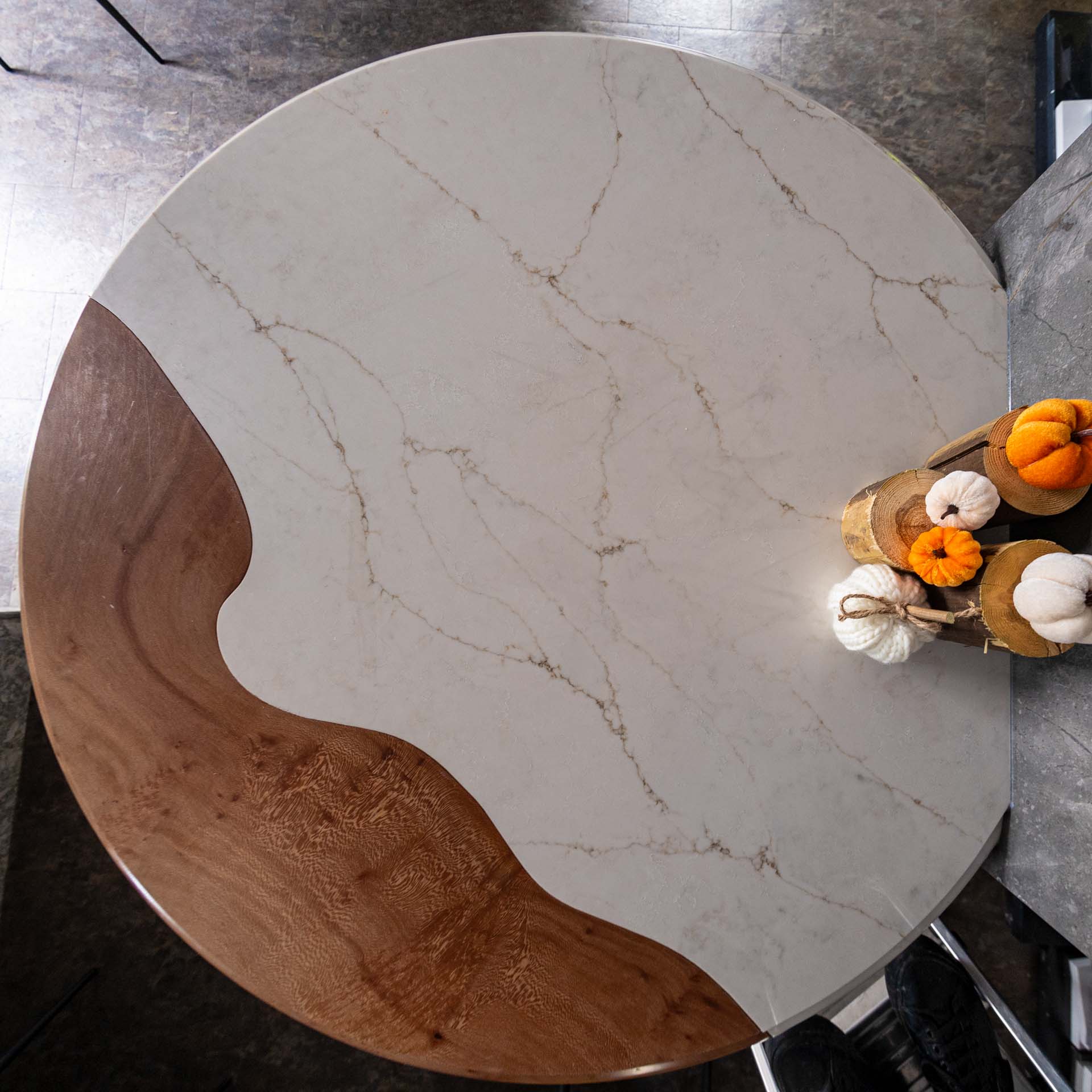 Circular table top in showroom BQS capri quartz and oak from Nick Geard Furniture
