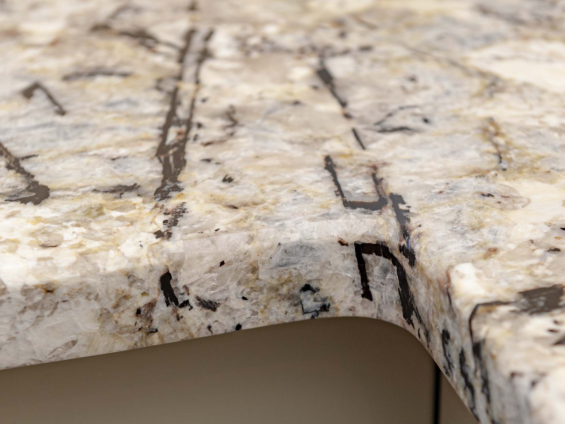 Arctic cream granite worktops close up of internal corner at L shape