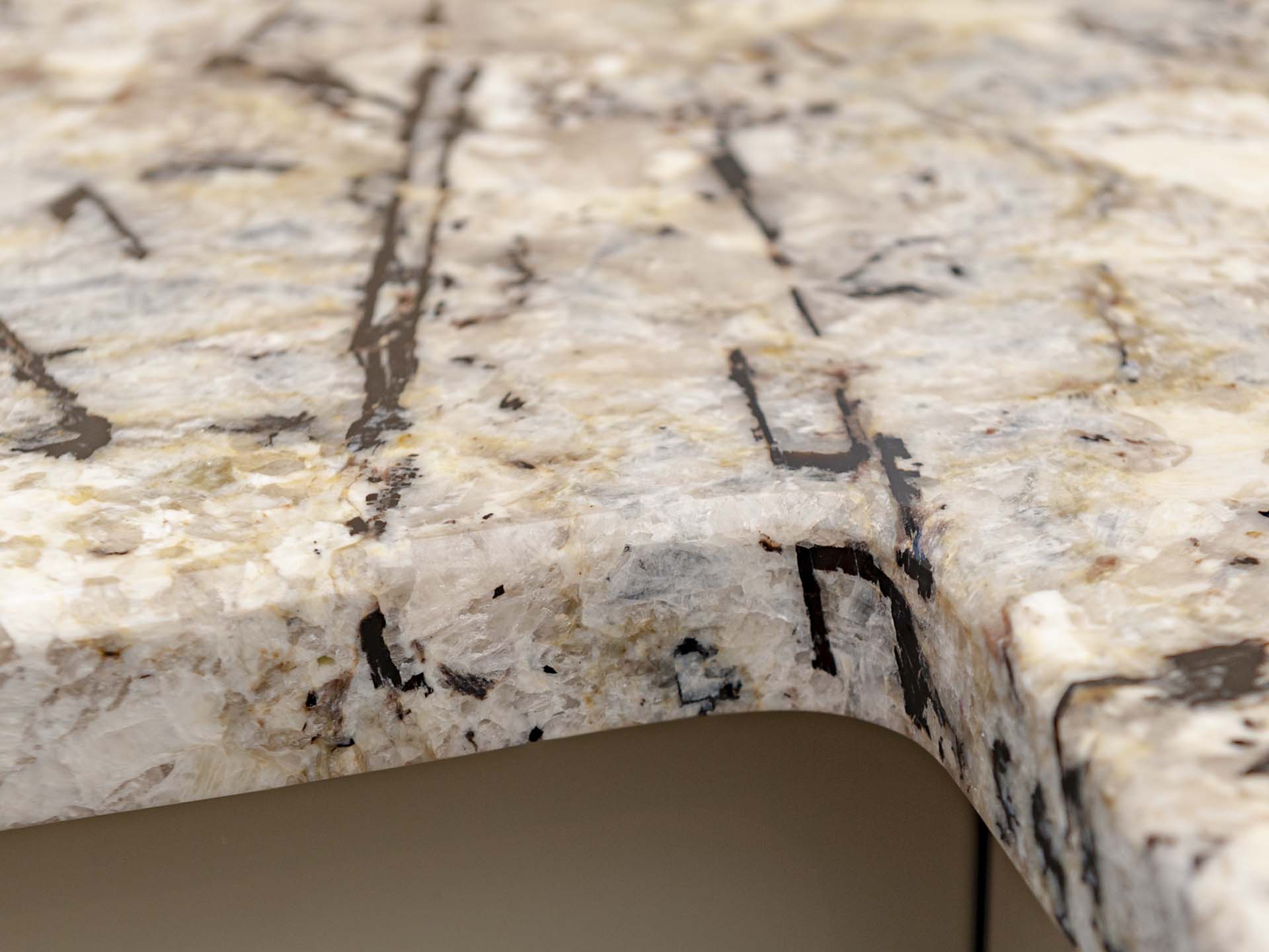 Arctic cream granite worktops close up of internal corner at L shape Arctic cream granite worktops close up of internal corner at L shape