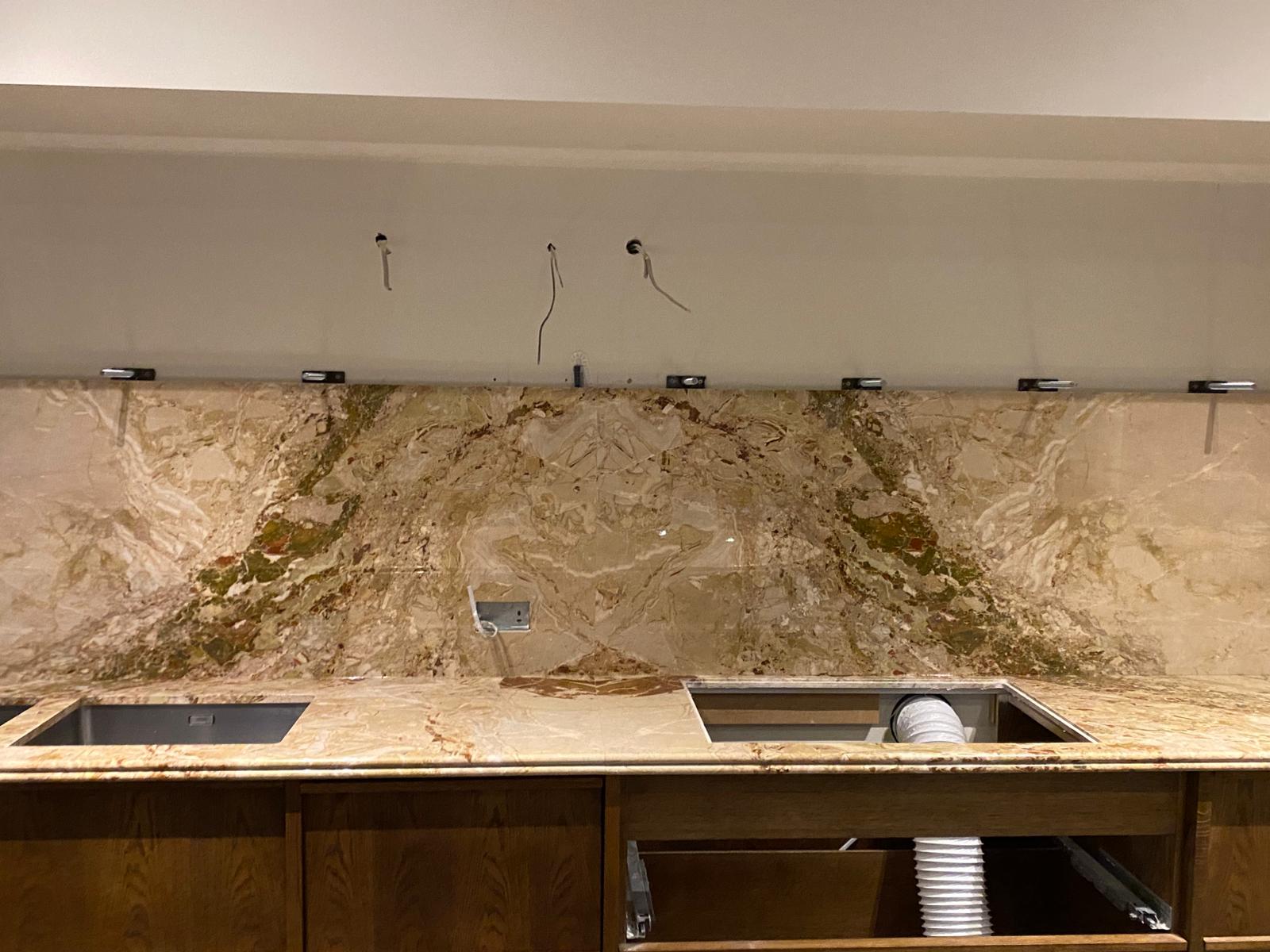 bookmatched splashback in Brecchia Fantasia marble