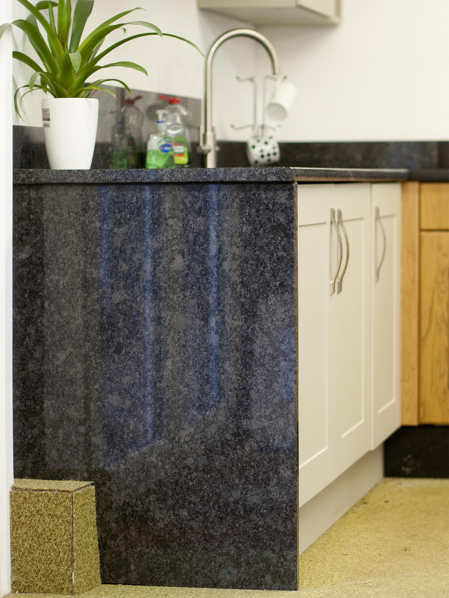 Butted waterfall downstand steel grey granite worktops