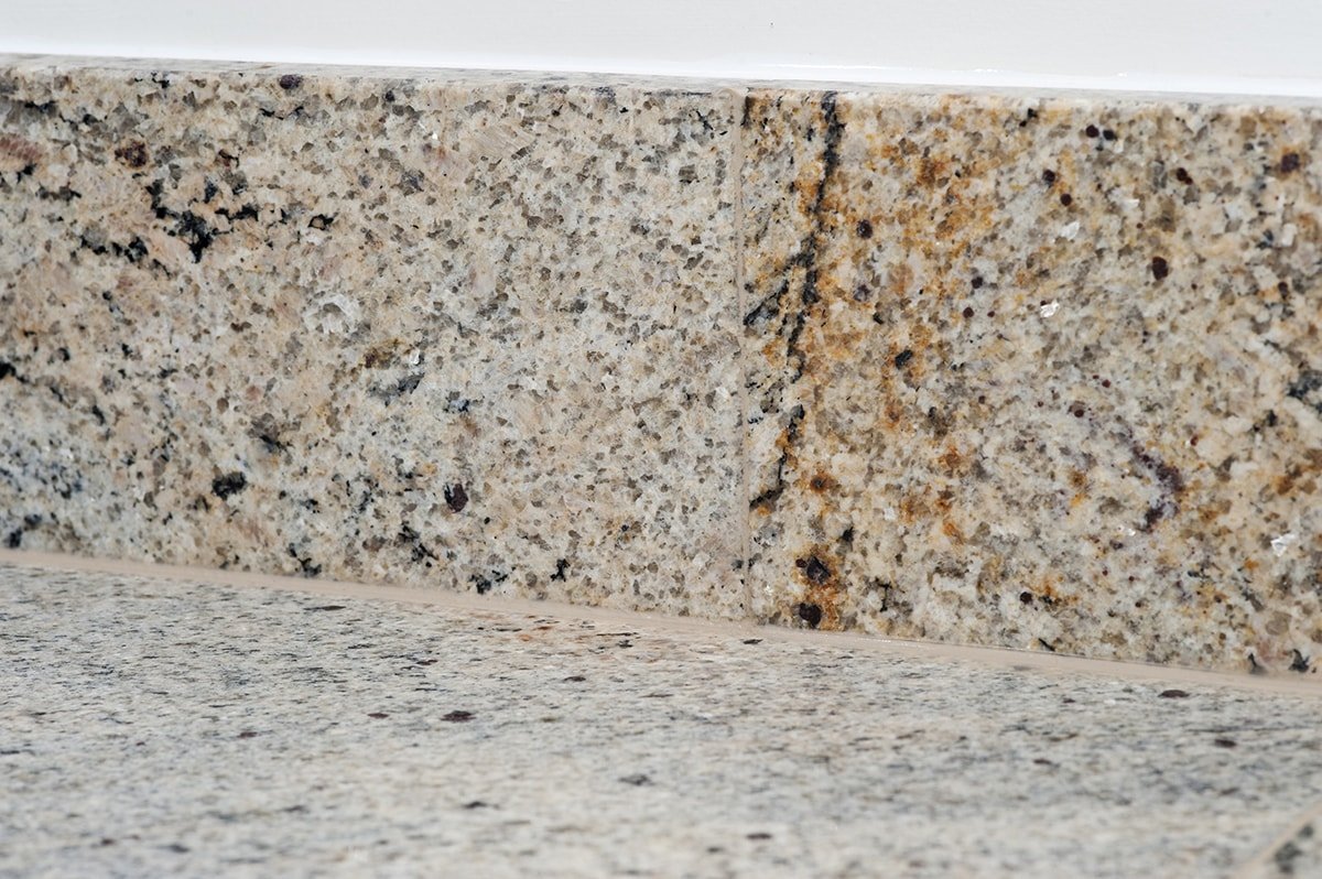 ivory-fantasy-granite-guildford-artington-surrey-120644-a-upstand-detail-min