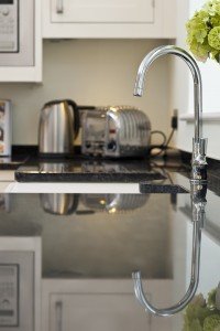 steel-grey-granite-cuckfield-west-sussex-yew-tree-kitchens-112136a-sink-tap-min